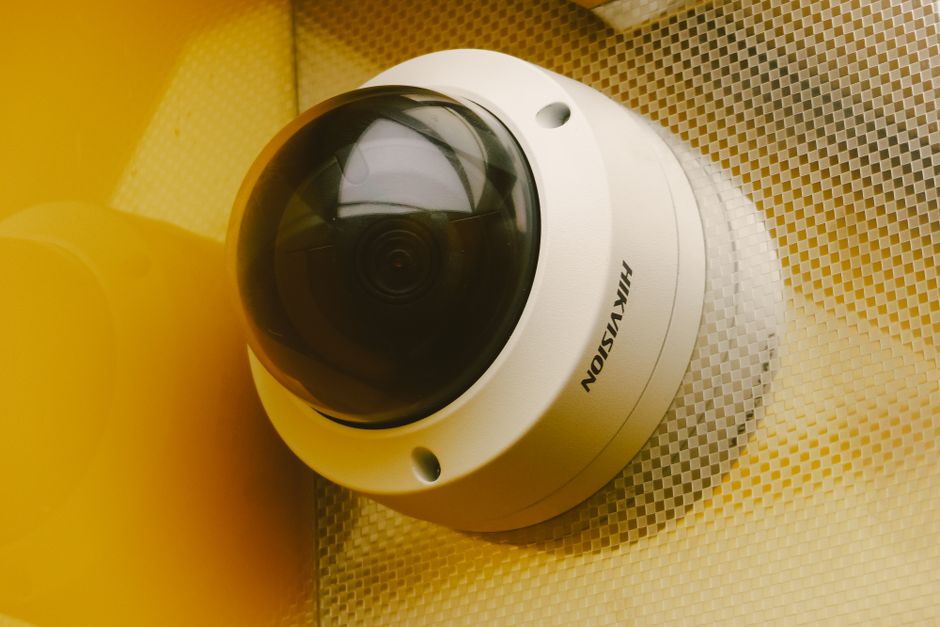 Surveillance cameras being set up on a commercial property
