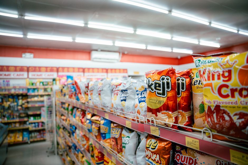 Packaged snacks and refreshments displayed on store shelves