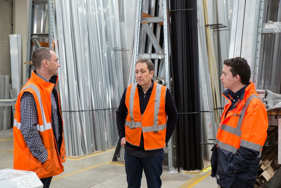Logistics team planning delivery schedules at a construction site