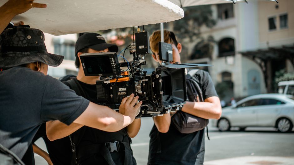 Professional film crew working on a movie set with lighting and cameras