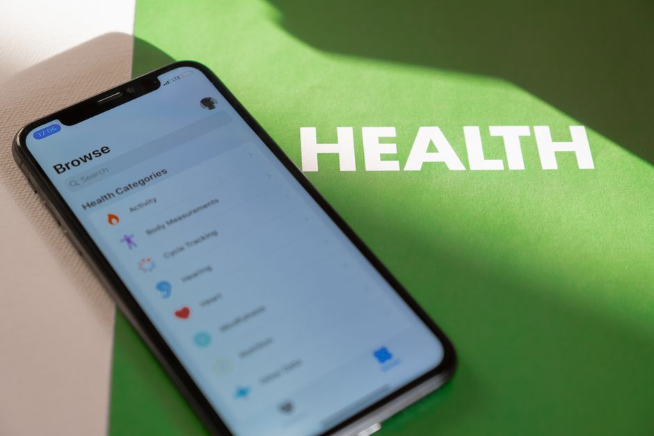Digital health professional reviewing health technology app data