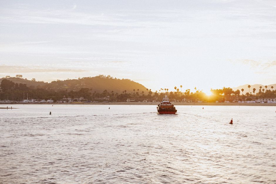 View of charter boats docked in Santa Barbara harbor at sunrise