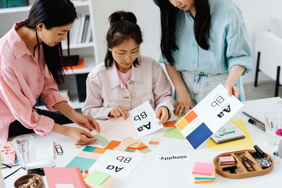 Collaborative branding team at work on digital campaign visuals