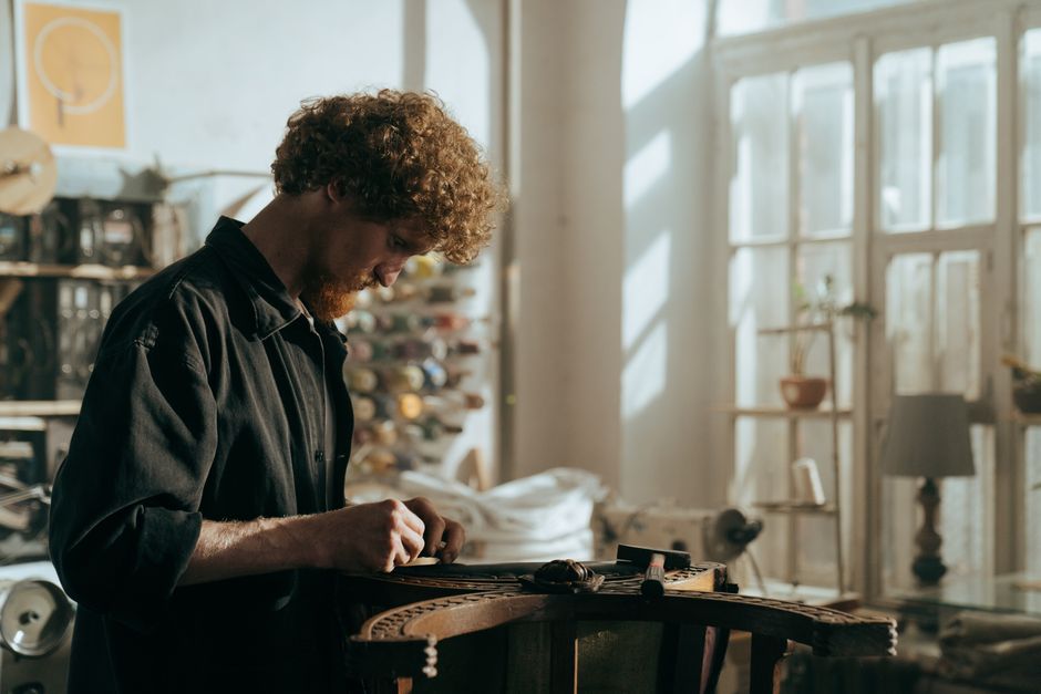 Skilled craftsman restoring a classic wooden chair