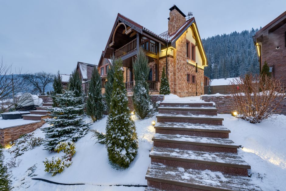 Exterior of a luxury resort property in winter, snow-covered landscape