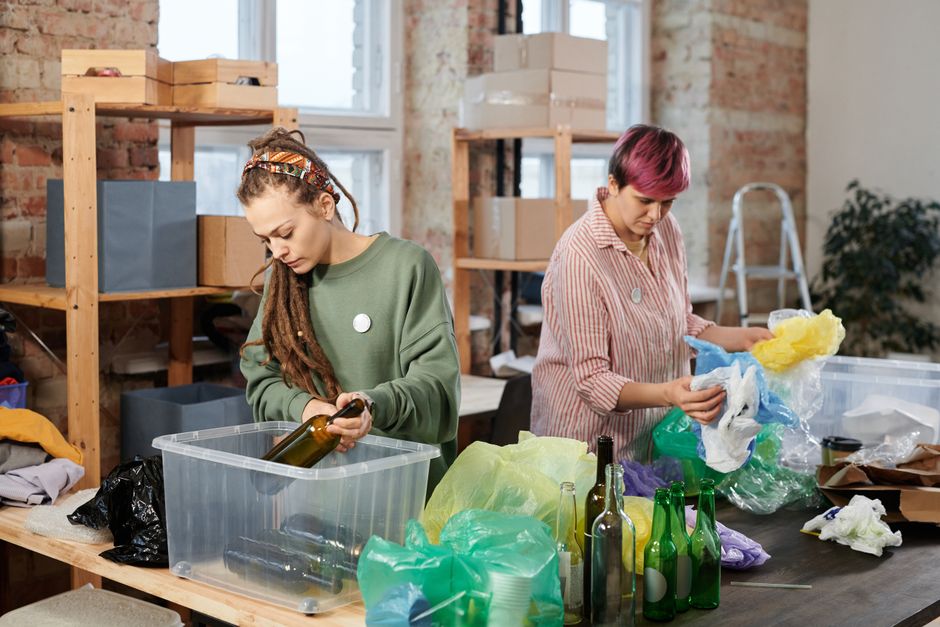 Piles of sorted plastic and glass bottles ready for recycling