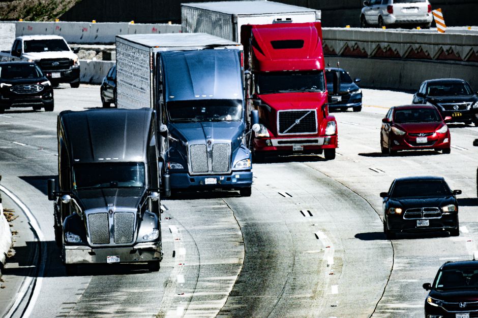 Commercial trucks equipped with GPS tracking systems on the highway