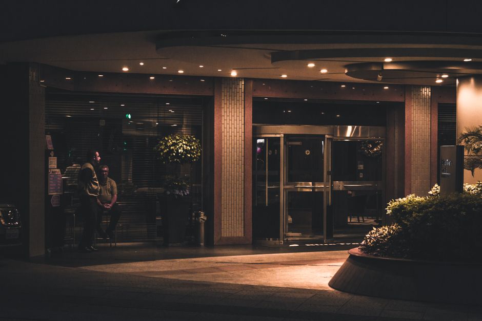 Commercial building lobby with management staff present