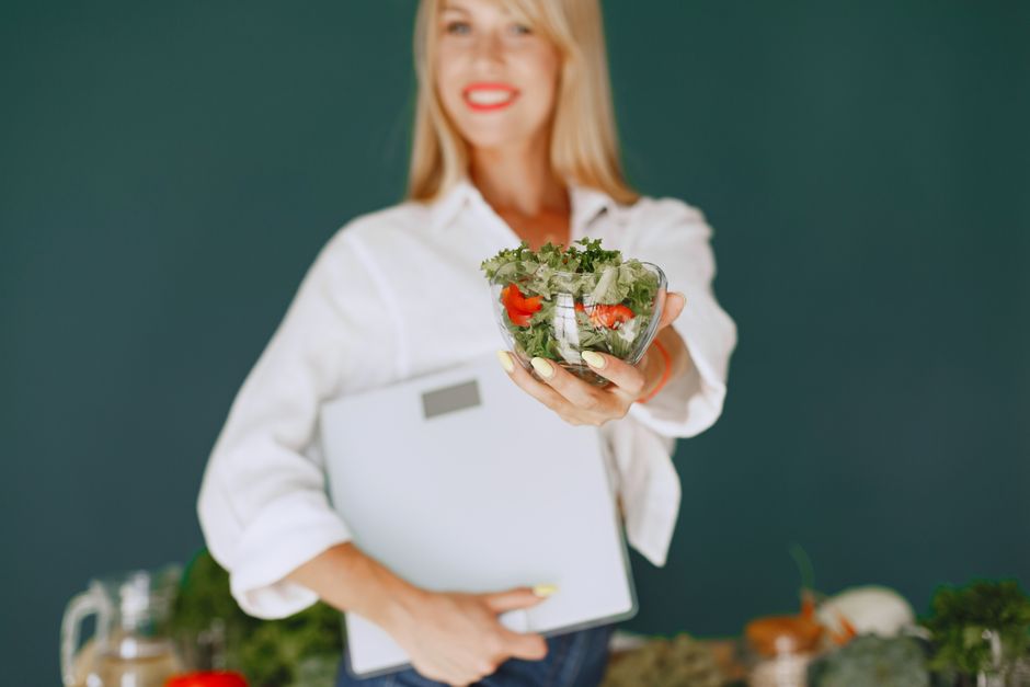 Nutritionist speaking with a patient about a weight loss program