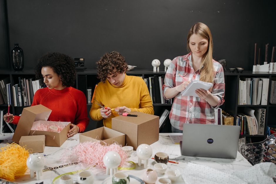 Creative team at work designing visual identities and product packaging.