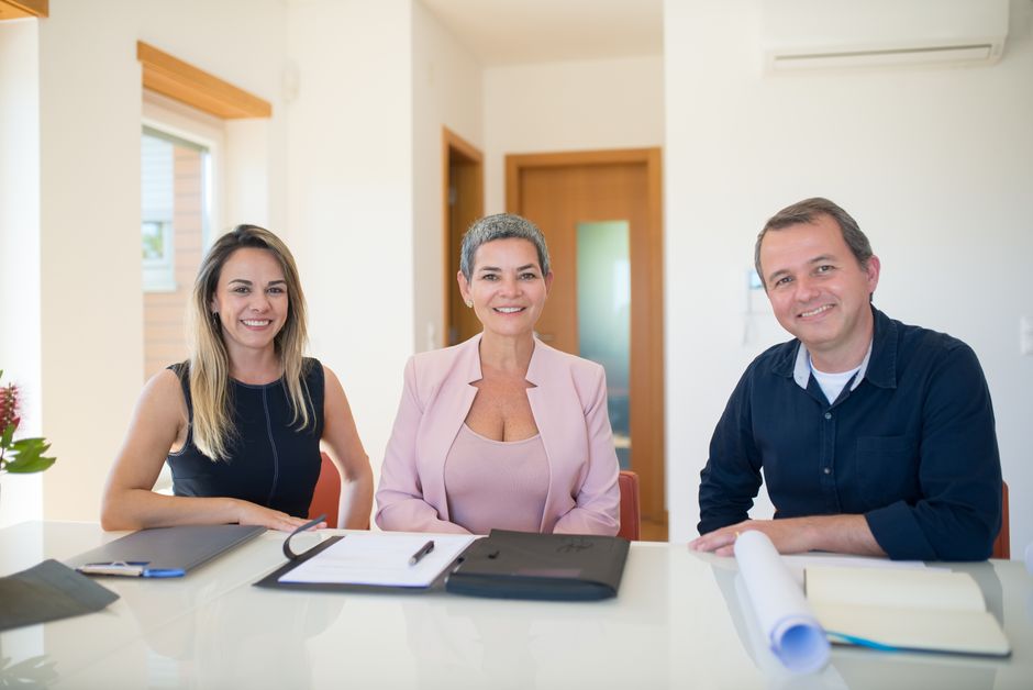Corporate real estate executive team discussing portfolio strategy