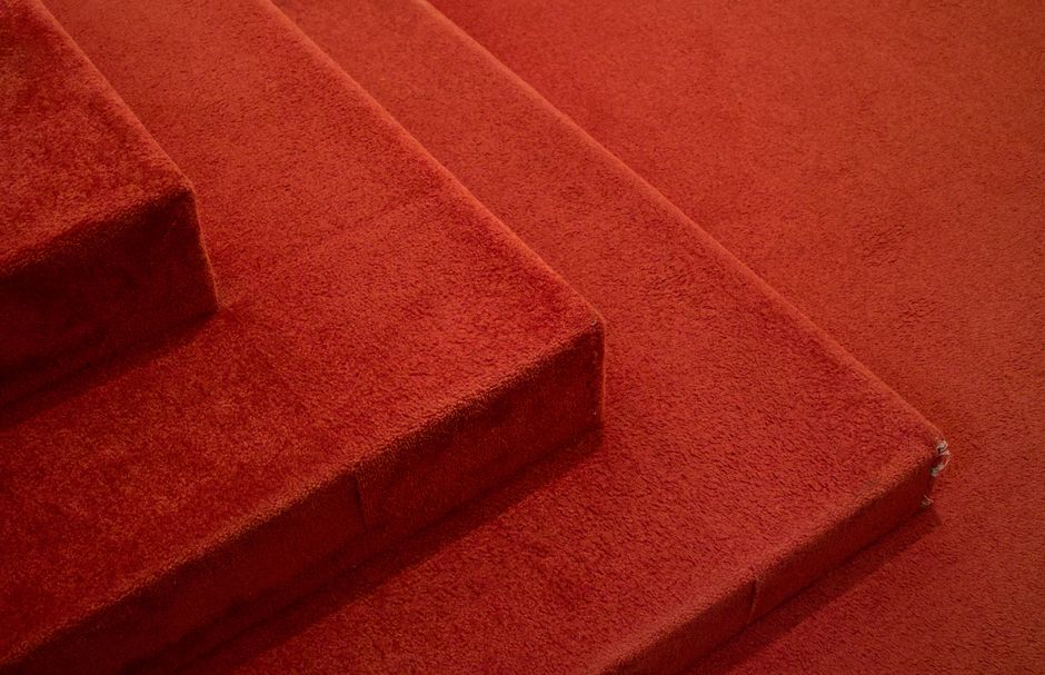 Detailed carpet installation process in progress