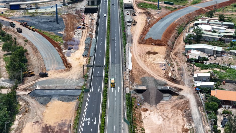 Crew and equipment constructing a roadway