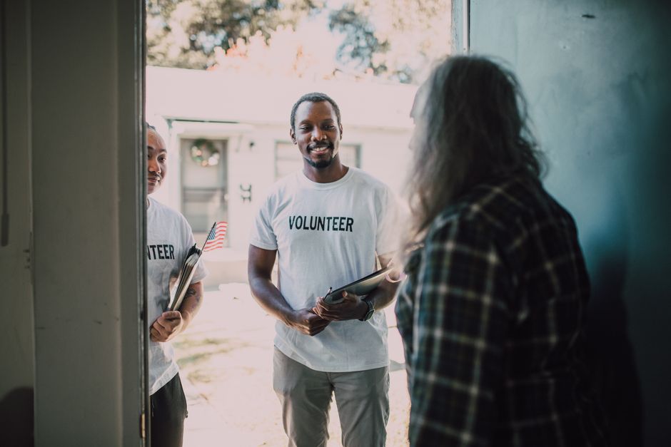 Nonprofit organization staff interacting with housing residents