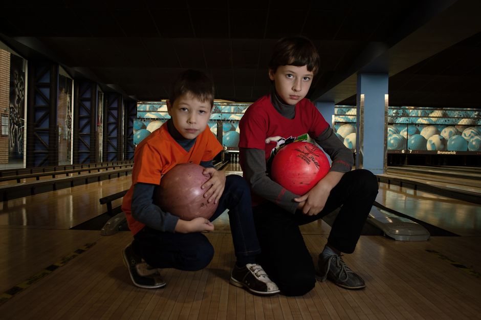 Children with disabilities bowling together