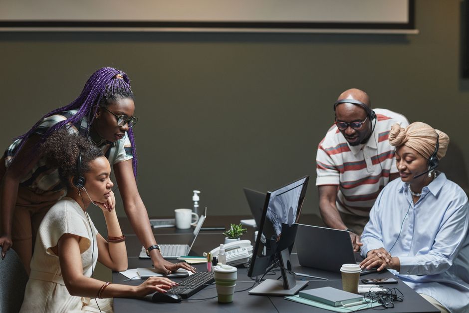 Business professionals collaborating with managed IT service support