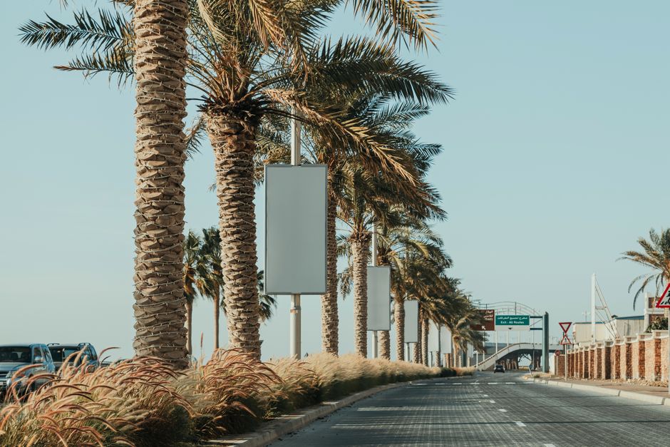 Traditional static billboard placed along a busy road