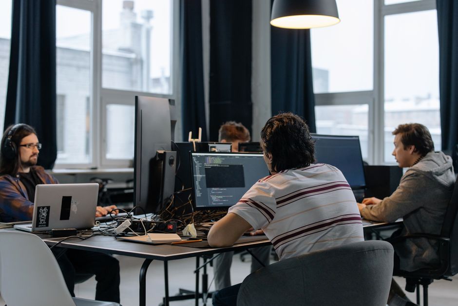 Software development team collaborating in a modern office environment