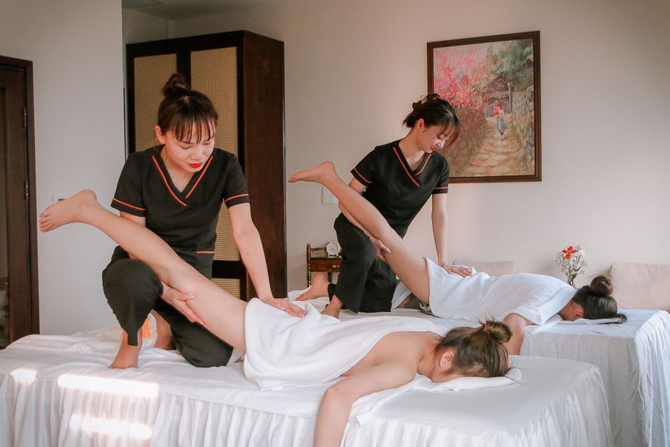 Professional Asian massage therapist at work