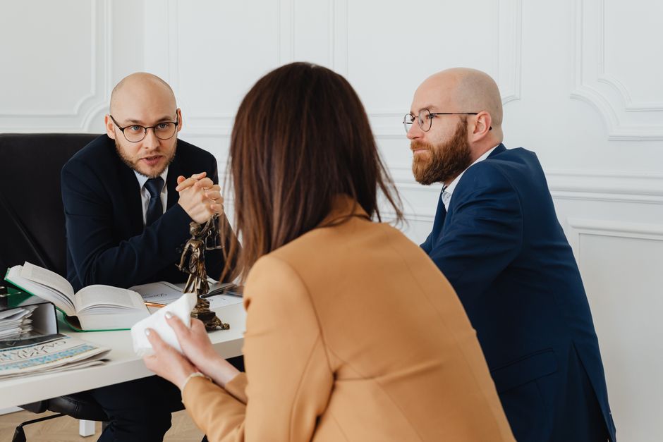 Lawyer consulting with a group of plaintiffs about legal options