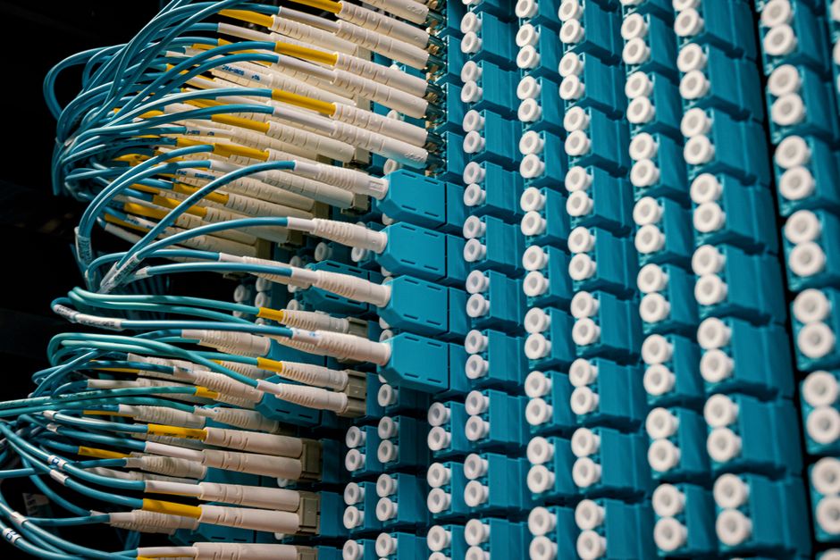 Technician installing fiber optic internet cable