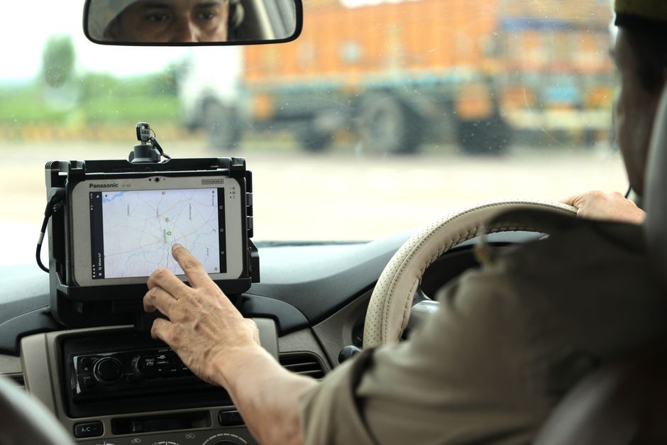 Specialists installing GPS tracking devices on various fleet vehicles