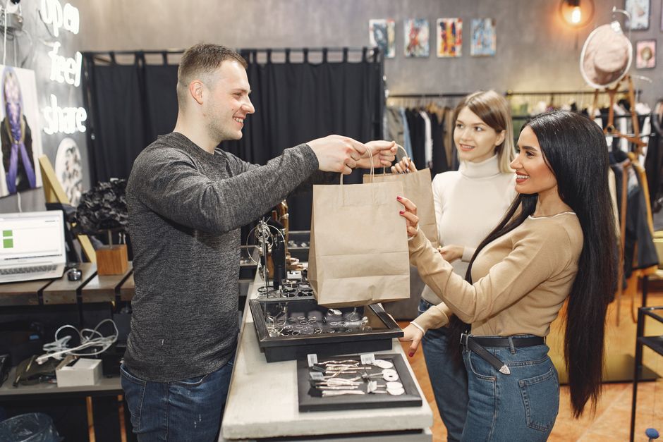 Store staff helping a customer at the counter