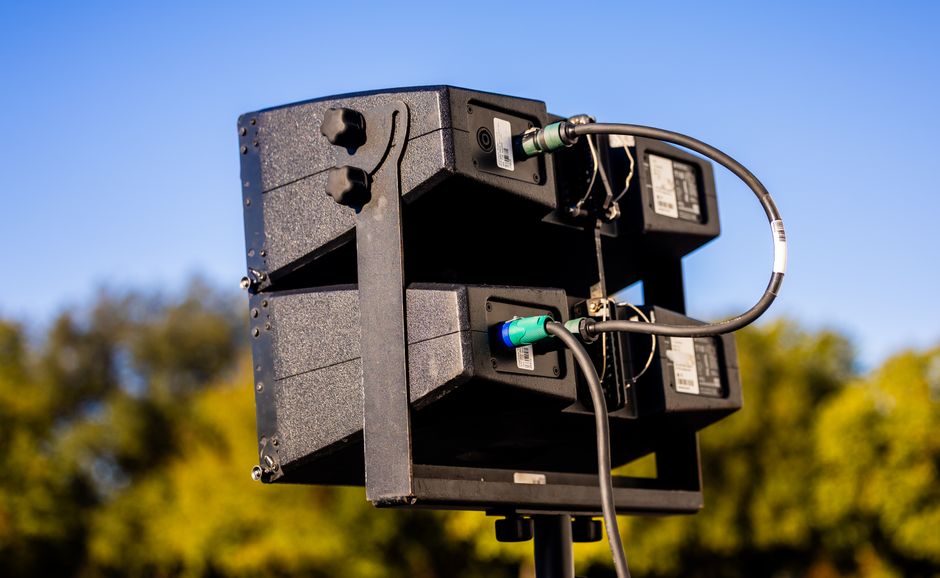 Professional audio equipment being installed in a commercial setting
