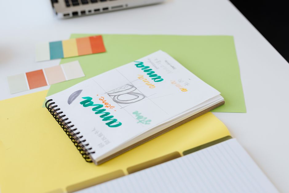 Creative branding workspace: designers collaborating over logos and sketches