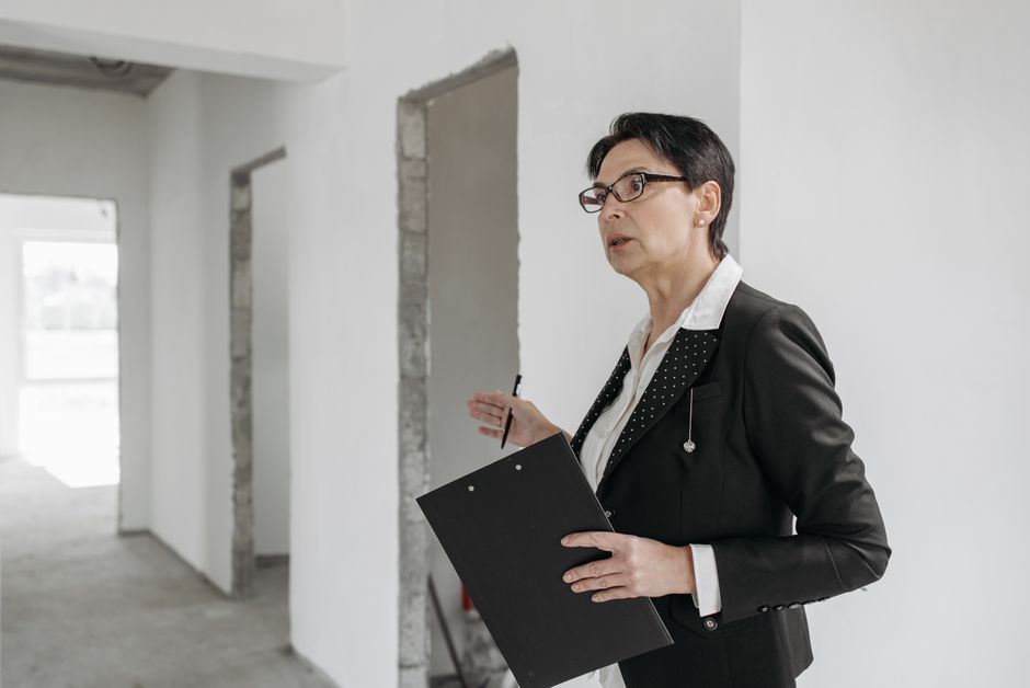 Architect reviewing site analysis and plans for residential project