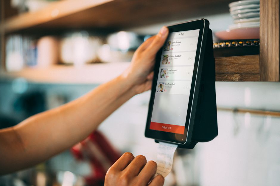 Modern point-of-sale terminal at restaurant checkout