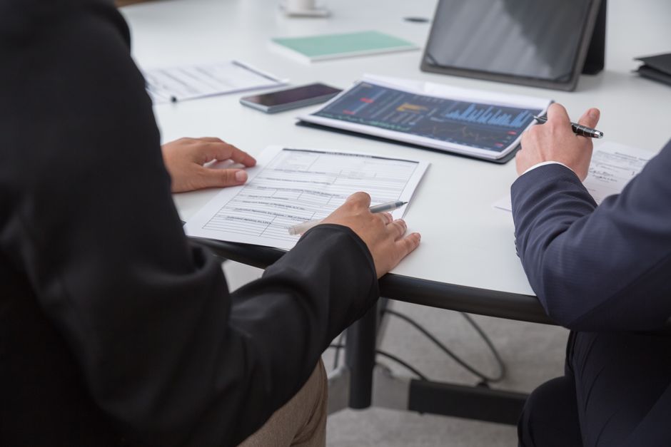 Team reviewing business data on a tablet
