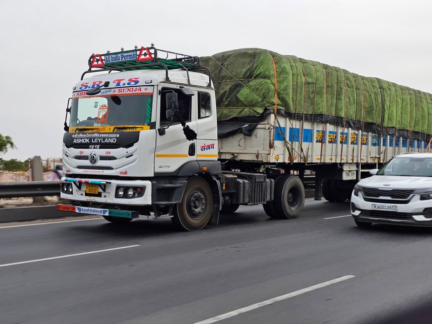 A commercial cargo truck traveling on a highway