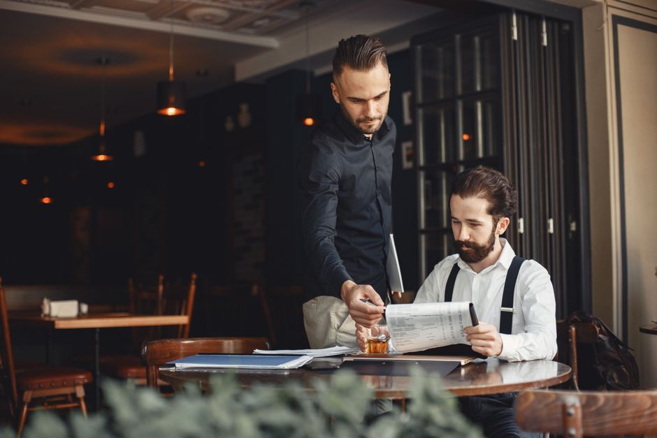 A group of food service professionals collaborating on a menu
