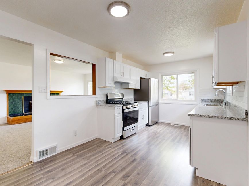 Modern remodeled kitchen with updated appliances and finishes