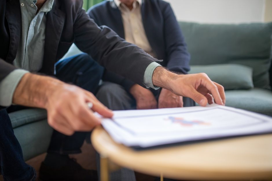 Business documents and portfolio paperwork for a holding company