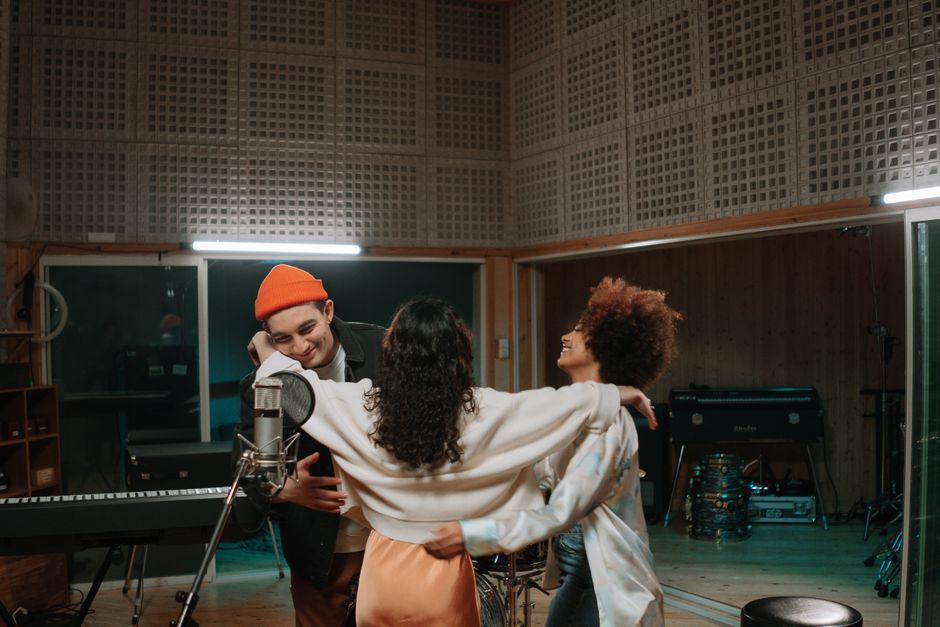 Creative team collaborating in a music production studio