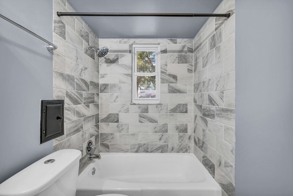 Modern kitchen and bathroom shown during a remodeling project