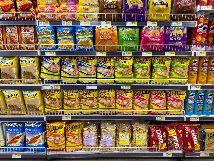 Snacks and packaged foods displayed in a supermarket