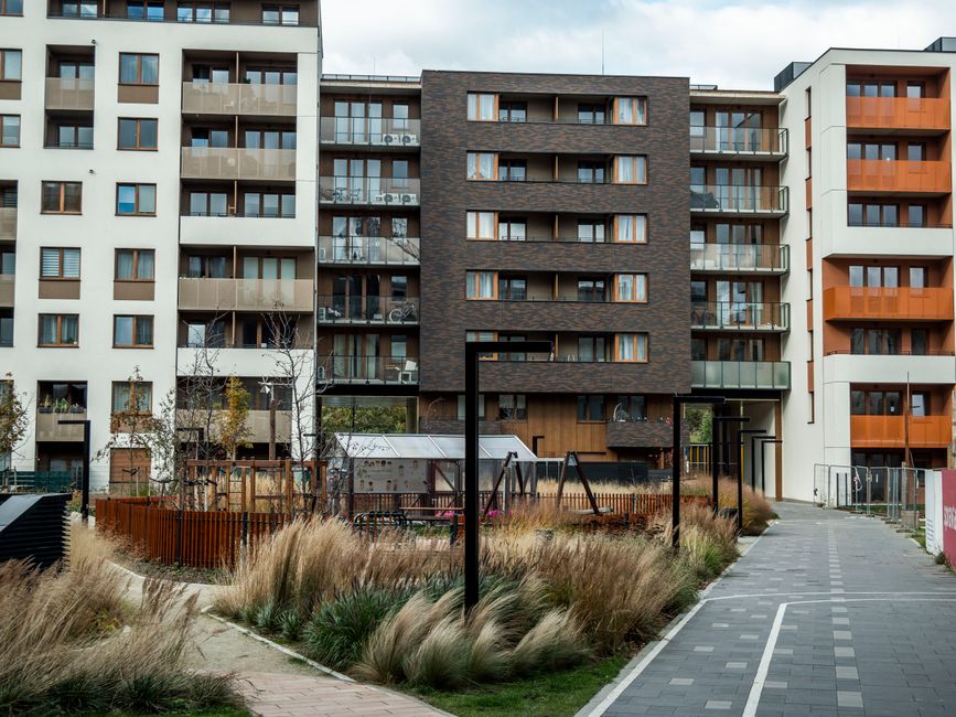 Modern mixed-use apartment building with retail and parking