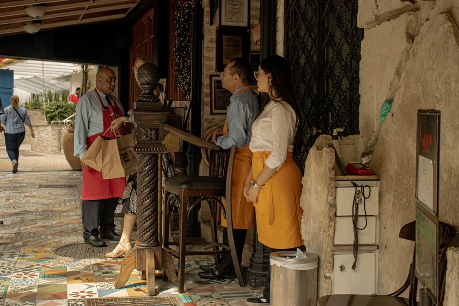Restaurant staff providing friendly service to customers