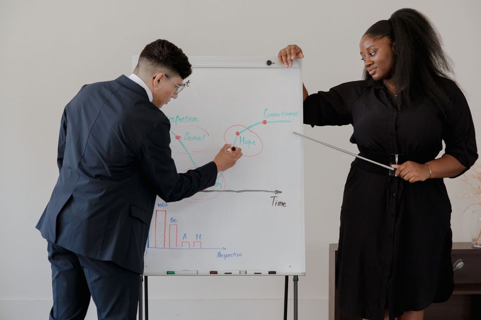 Coach discussing leadership goals with a professional