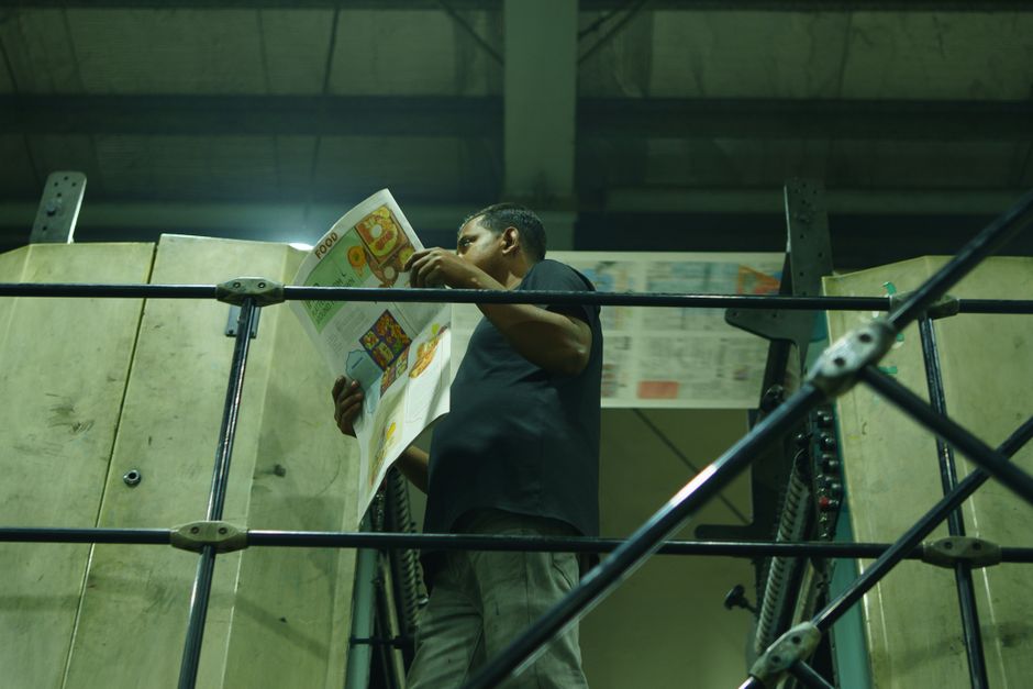 Production area of a large format print facility with staff working