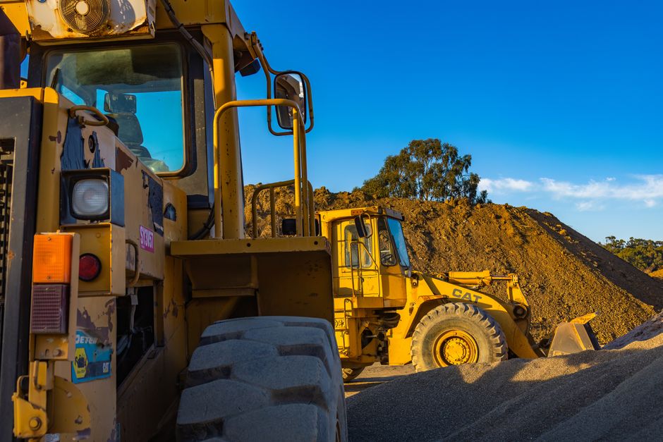 Heavy construction equipment in operation at a large work site