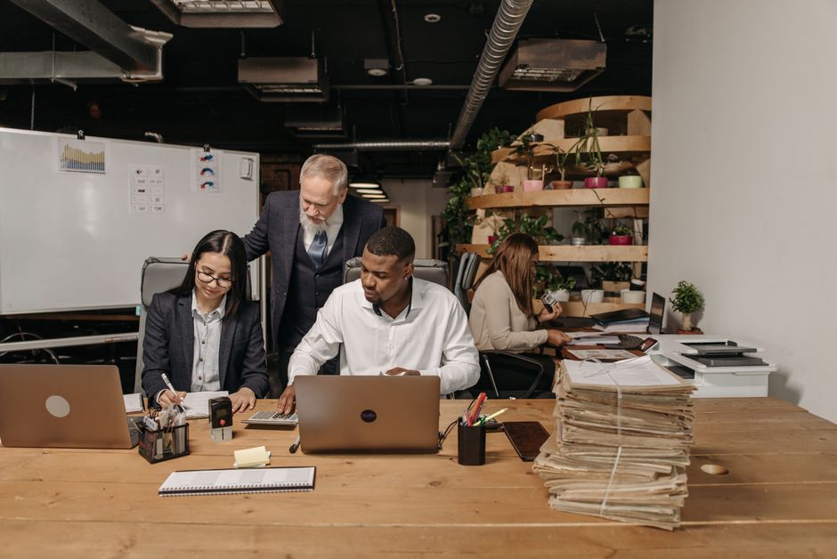Team reviewing operational efficiency in a modern office