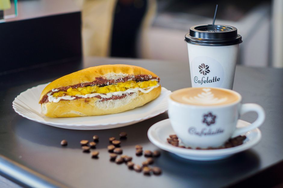 Takeaway breakfast sandwiches and coffee