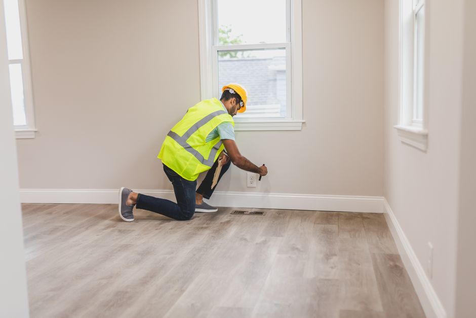 Technician performing maintenance in an apartment