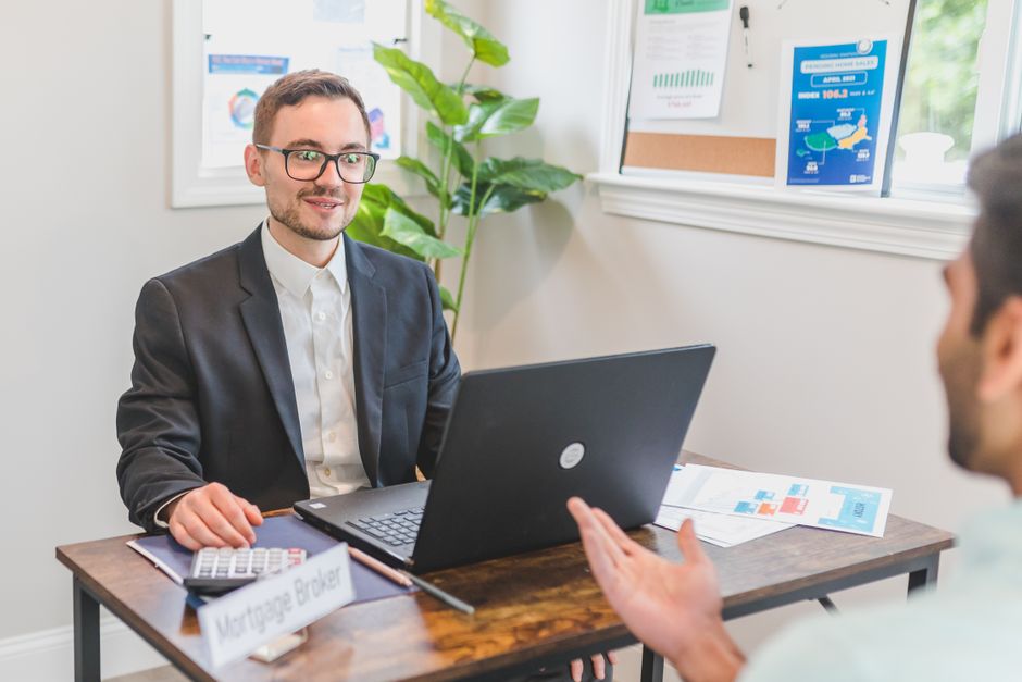 Illustrative stock photo of a professional financial advisor at a desk