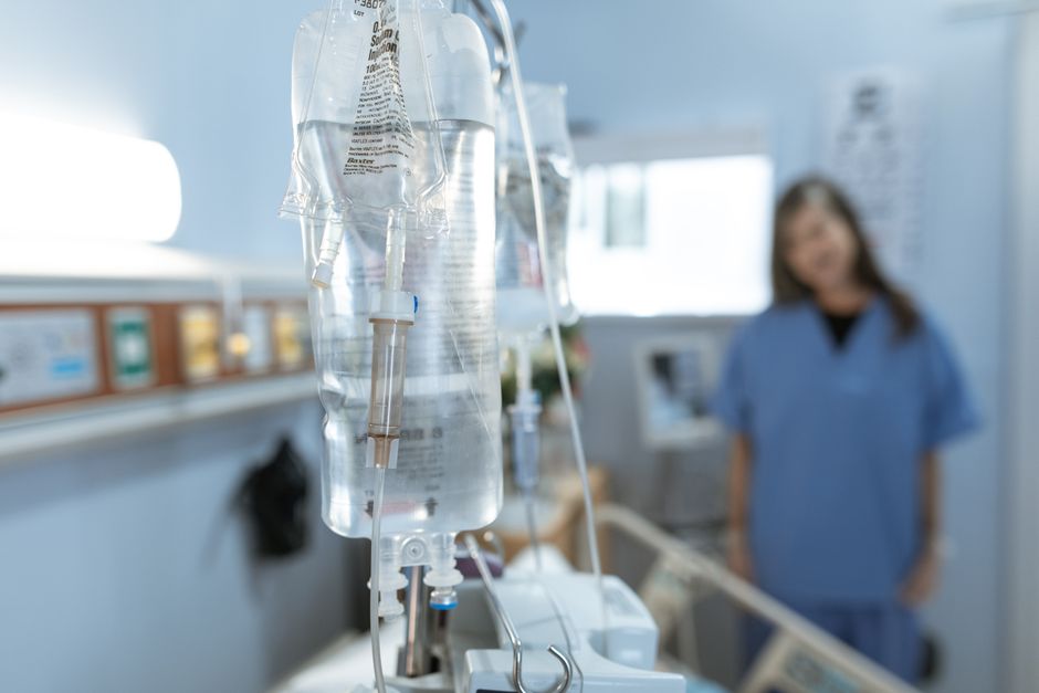 Patient receiving IV infusion therapy at a clinic