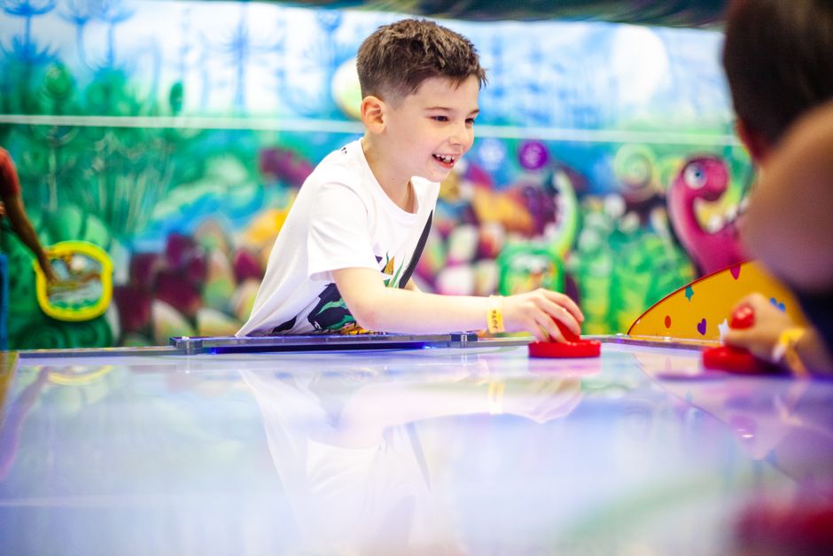 Kids and parents enjoying activities at a family entertainment center